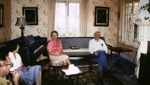 summer-2025-newsletter-156 Four adults seated in sitting room in 1960s